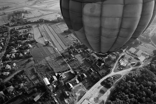 Grayscale Photo of Hot Air Balloon in the Sky