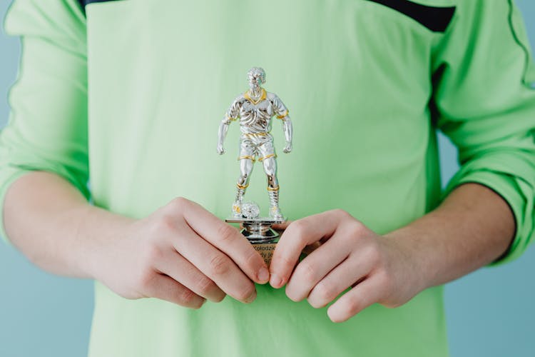 Person Holding A Trophy