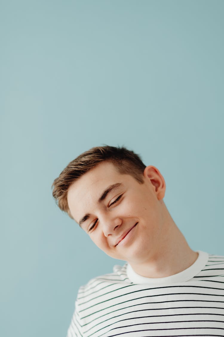 Smiling Caucasian Guy Posing On Blue Background