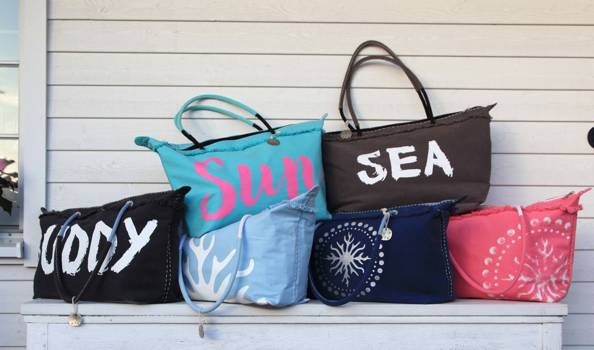 Collection of beach bags on table