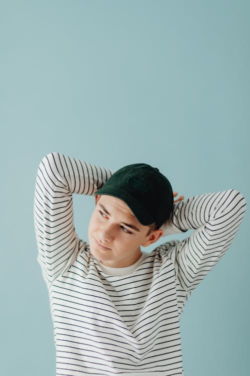 Studio Portrait of a Boy in a Baseball Cap