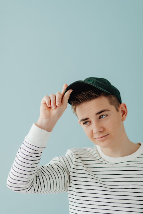 Studio Portrait of a Boy in a Baseball Cap