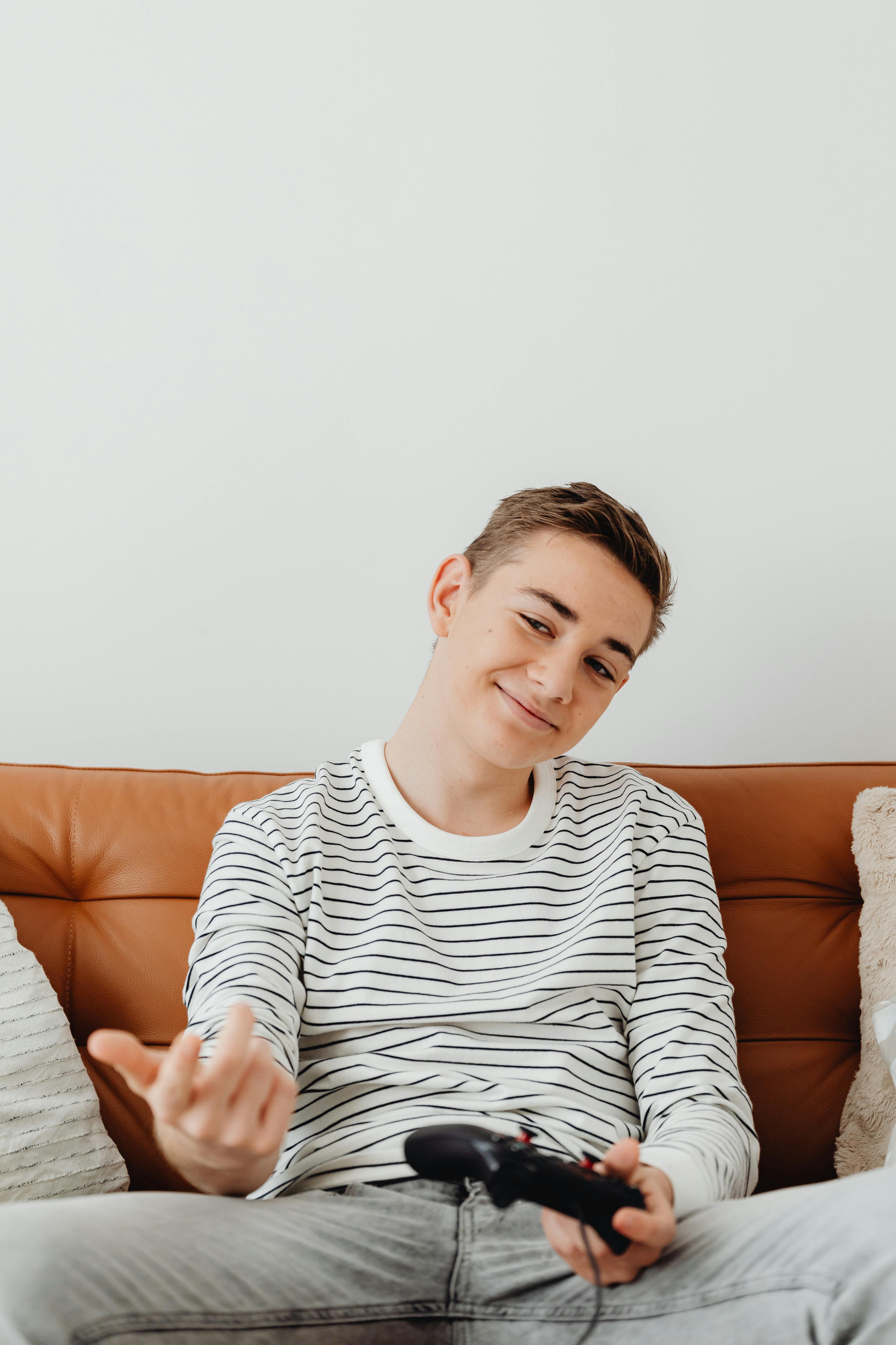 guy playing video game on couch