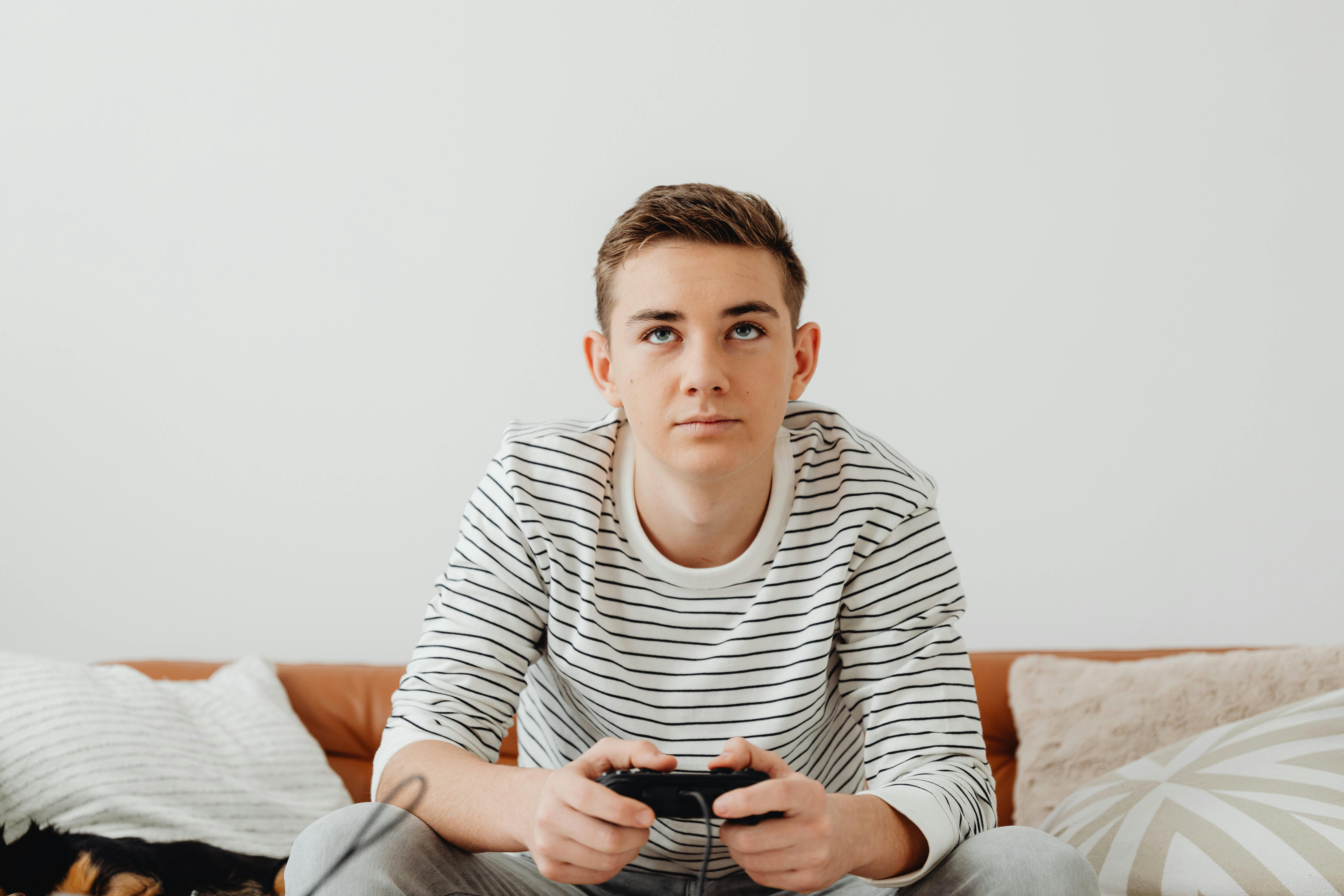 186 Sitting On Ground Playing Video Games Stock Photos, High-Res