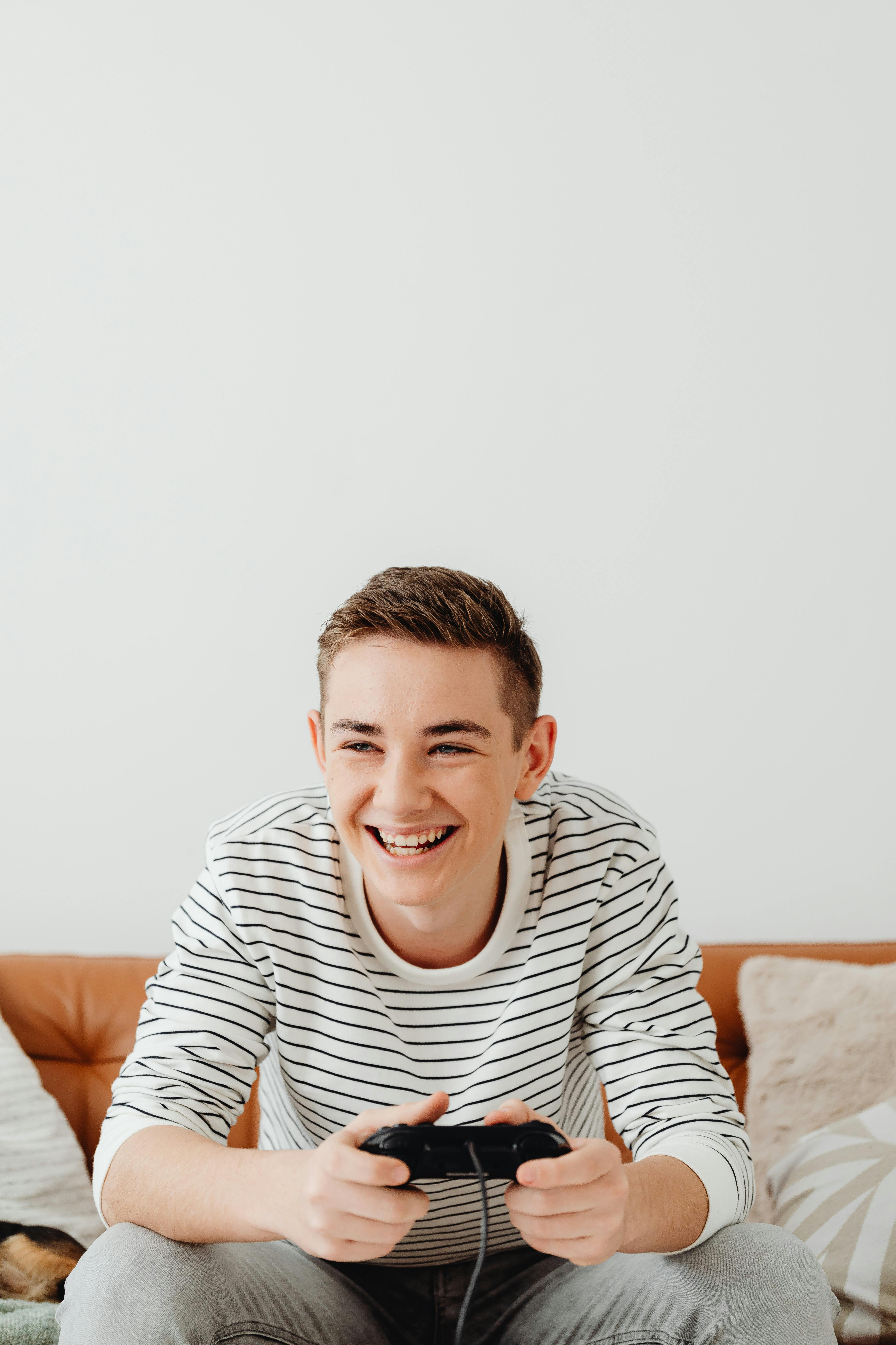 happy young man playing video game