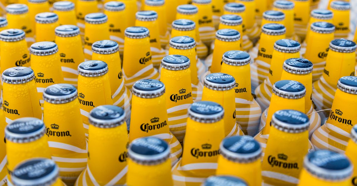 A close-up view of chilled Corona beer bottles displaying repetition and cool refreshment.
