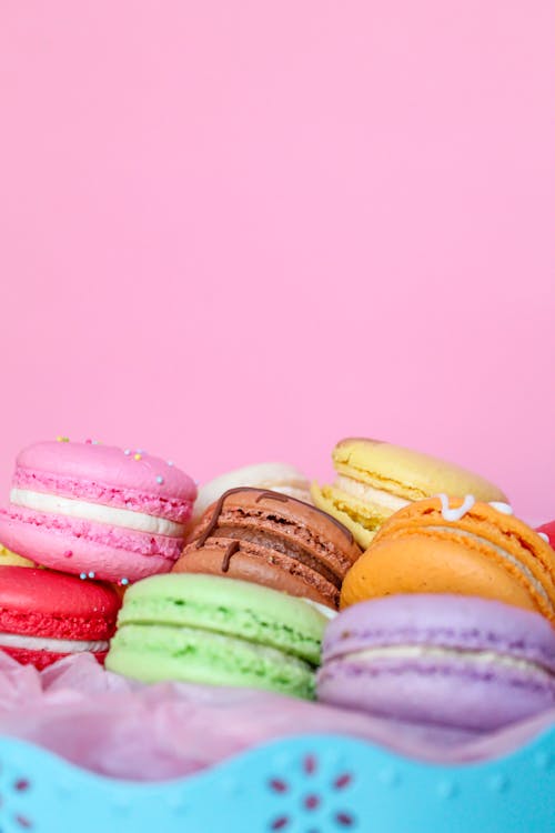 Close-Up Shot of French Macarons on Pink Background