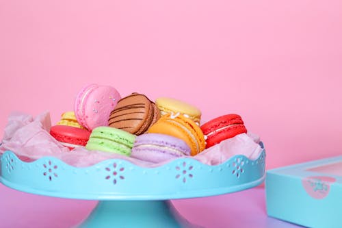 Close-Up Shot of French Macarons on Blue Plastic Tray