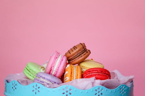 Close-Up Shot of French Macarons on Pink Background