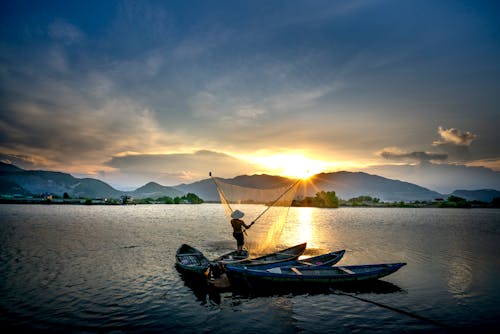 Δωρεάν στοκ φωτογραφιών με αλιεία, Ανατολή ηλίου, άνδρας Φωτογραφία από στοκ φωτογραφιών