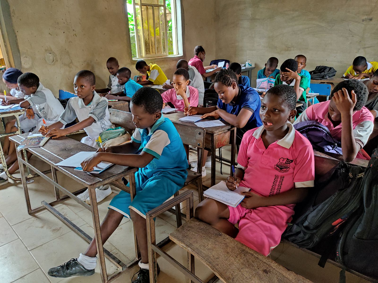 Nigerian primary students studying in class