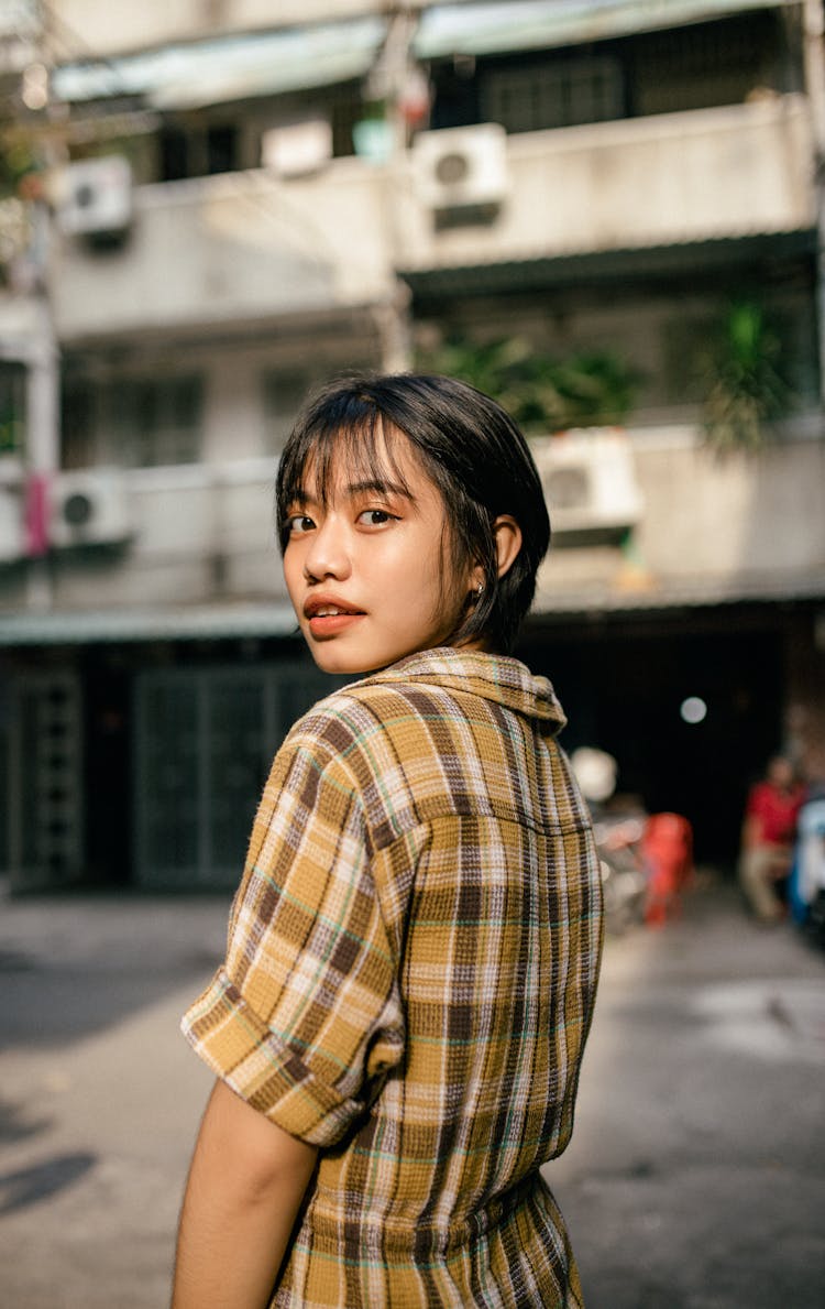 Positive Young Woman On Urban Street