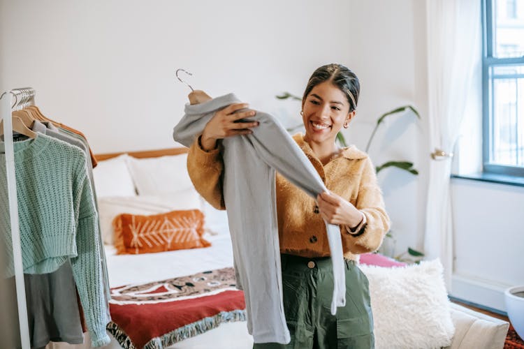 Happy Woman With Shirt At Home