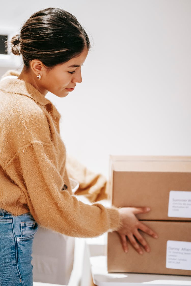 Young Woman With Delivered Carton Boxes