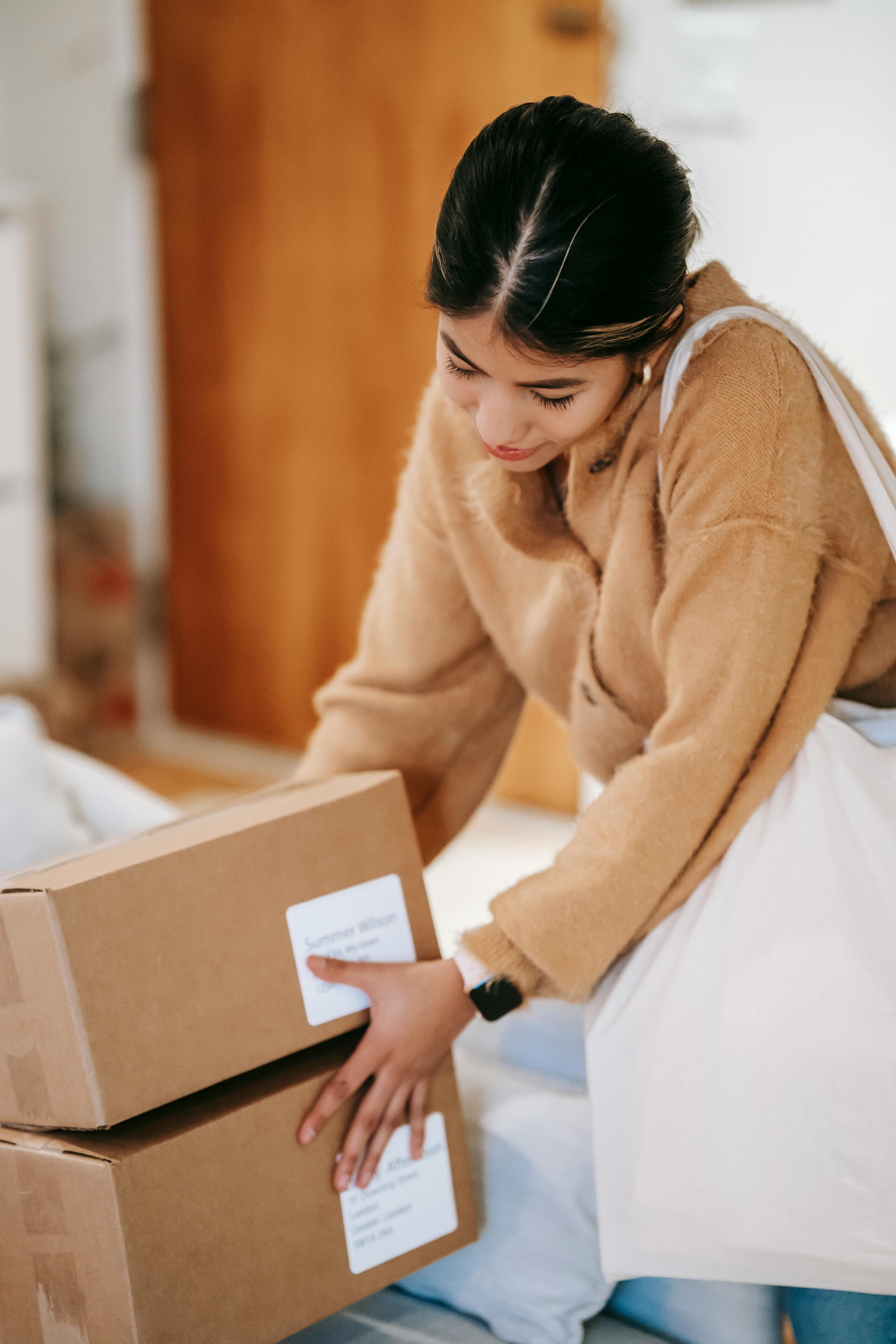 young woman taking boxes came from postal service