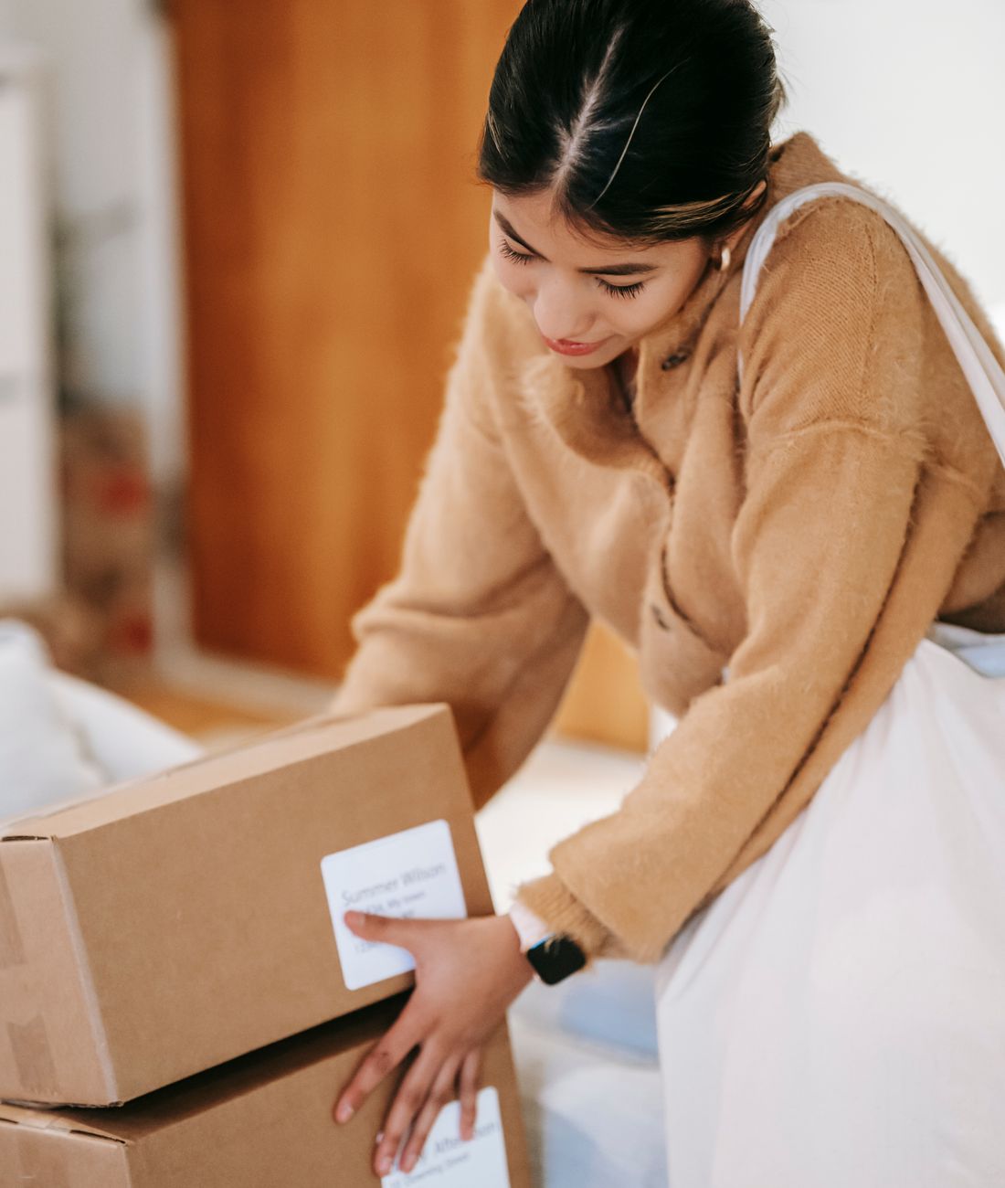 A customer unboxing delivered packages from an online order