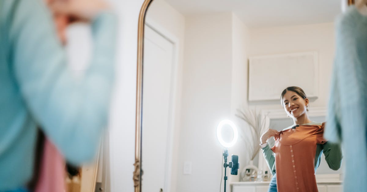 Woman filming content with ring light setup at home