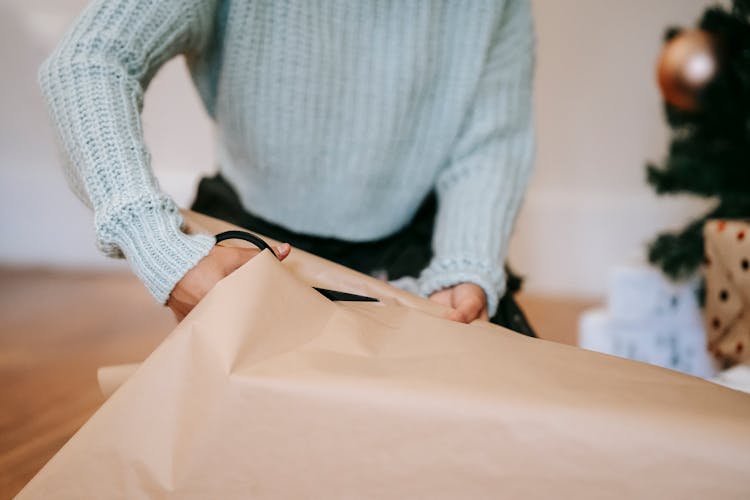 Crop Craftswoman Cutting Wrapping Paper On Christmas Day