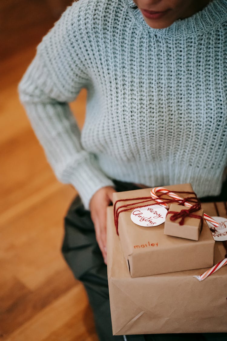 Crop Ethnic Woman With Heap Of Present Boxes In House