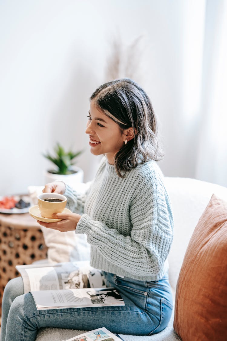 Smiling Woman Drinking Coffee And Looking Away