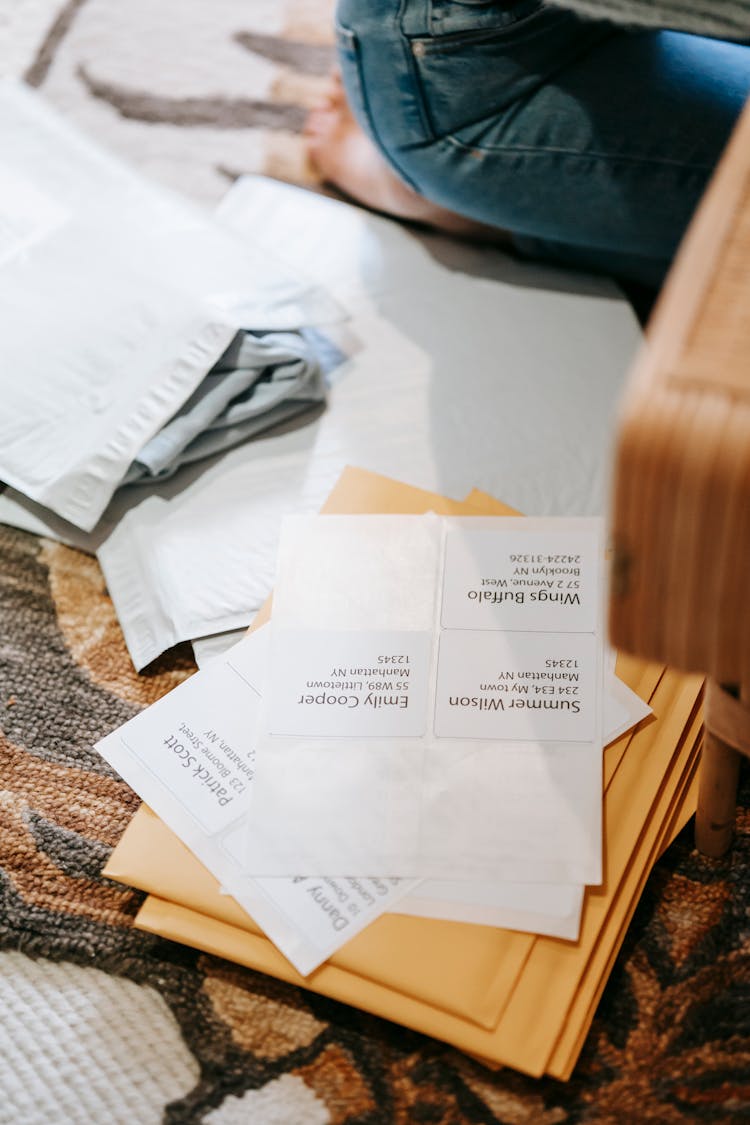 Faceless Female Near Shipping Parcel Bags With Address On Paper