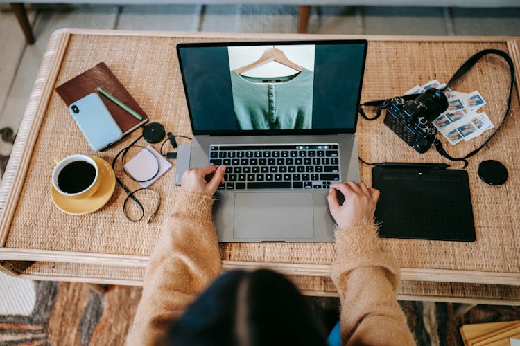 Faceless Photographer With Photo On Laptop Screen At Home