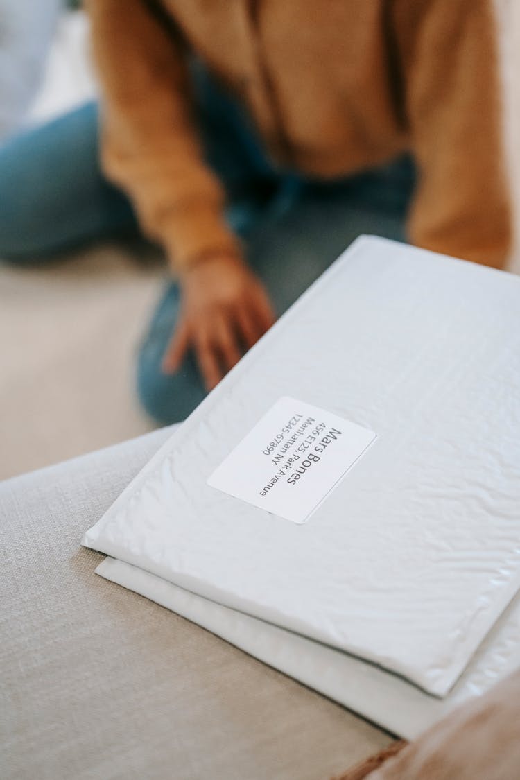 Shipping Parcel Bag Near Anonymous Lady In Room