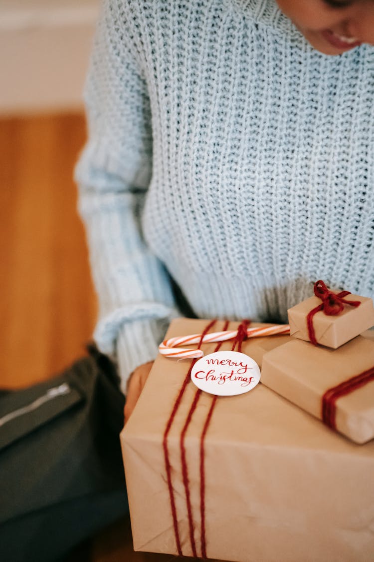 Crop Smiling Woman Receiving Wrapped Gift Boxes