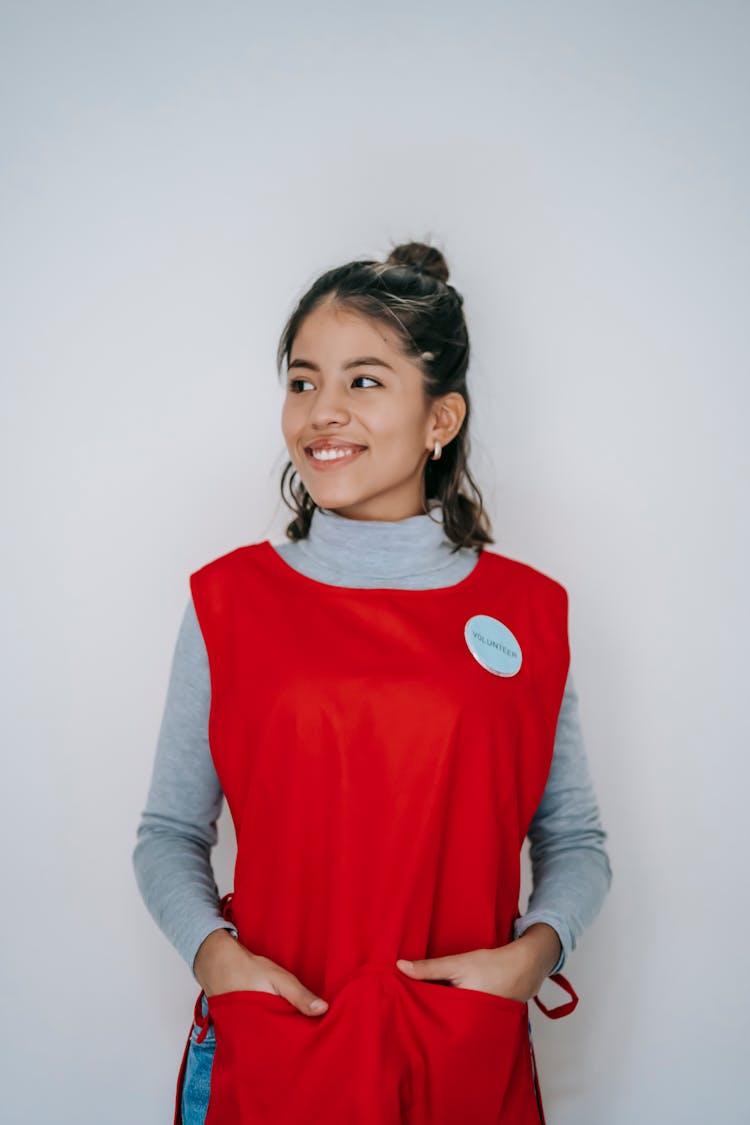 Young Happy Woman In Bright Red Apron Smiling