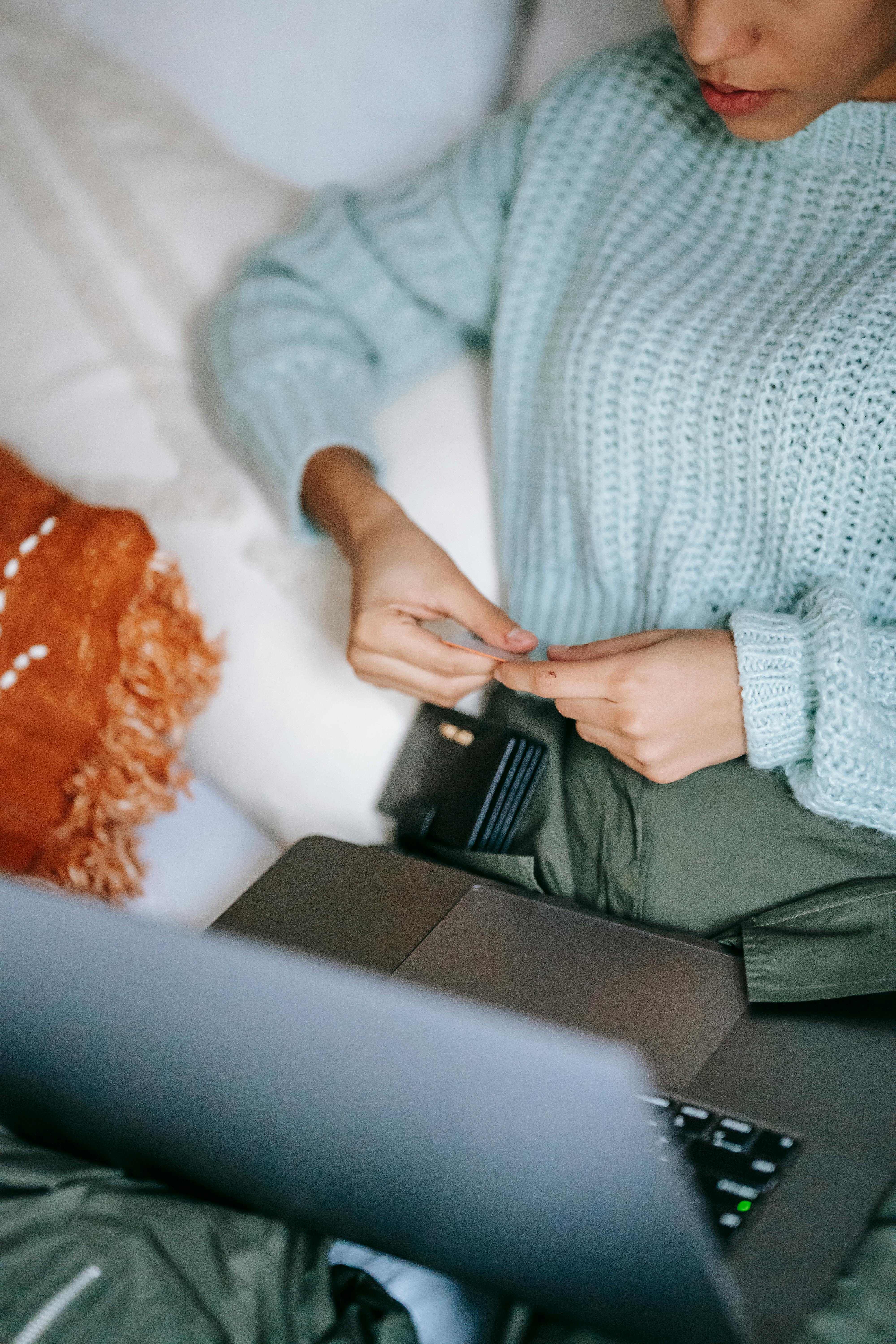 woman with wallet using laptop and shopping online