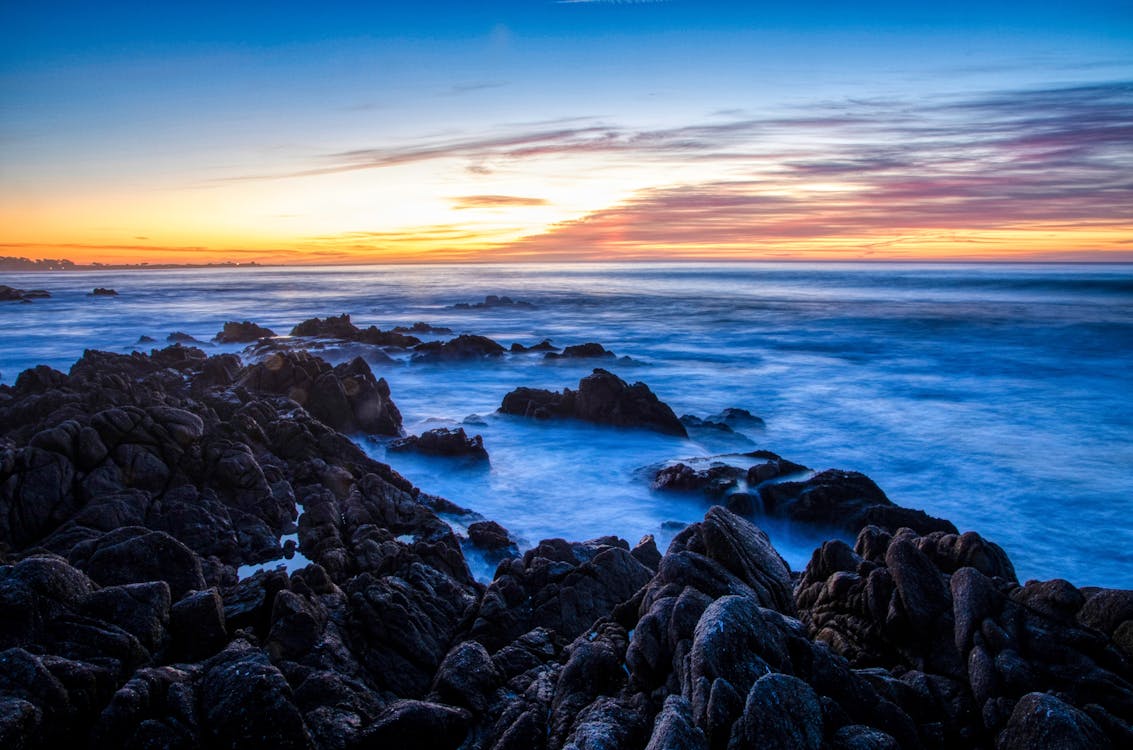 Rocks on the Ocean during Sunset