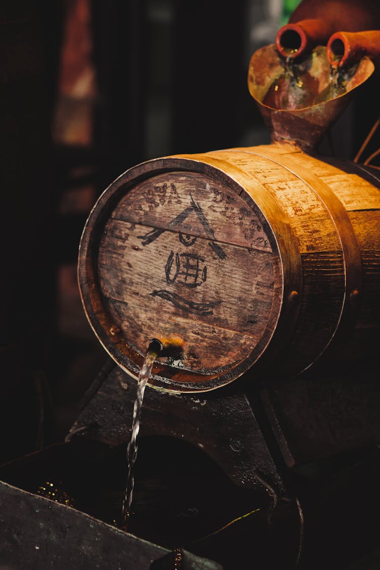 Beer Flowing From Wooden Barrel
