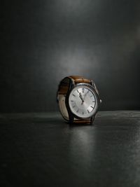 Classic analog watch on a dark surface — photo by Amaan Mustafa on Pexels