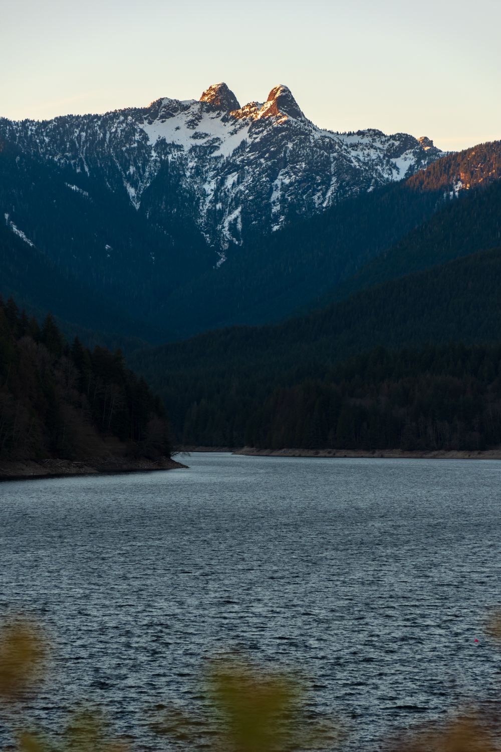 Nattipat Vesvarute Snow-capped Lions Gate mountains seen from Vancouver, Canada on a clear winter day