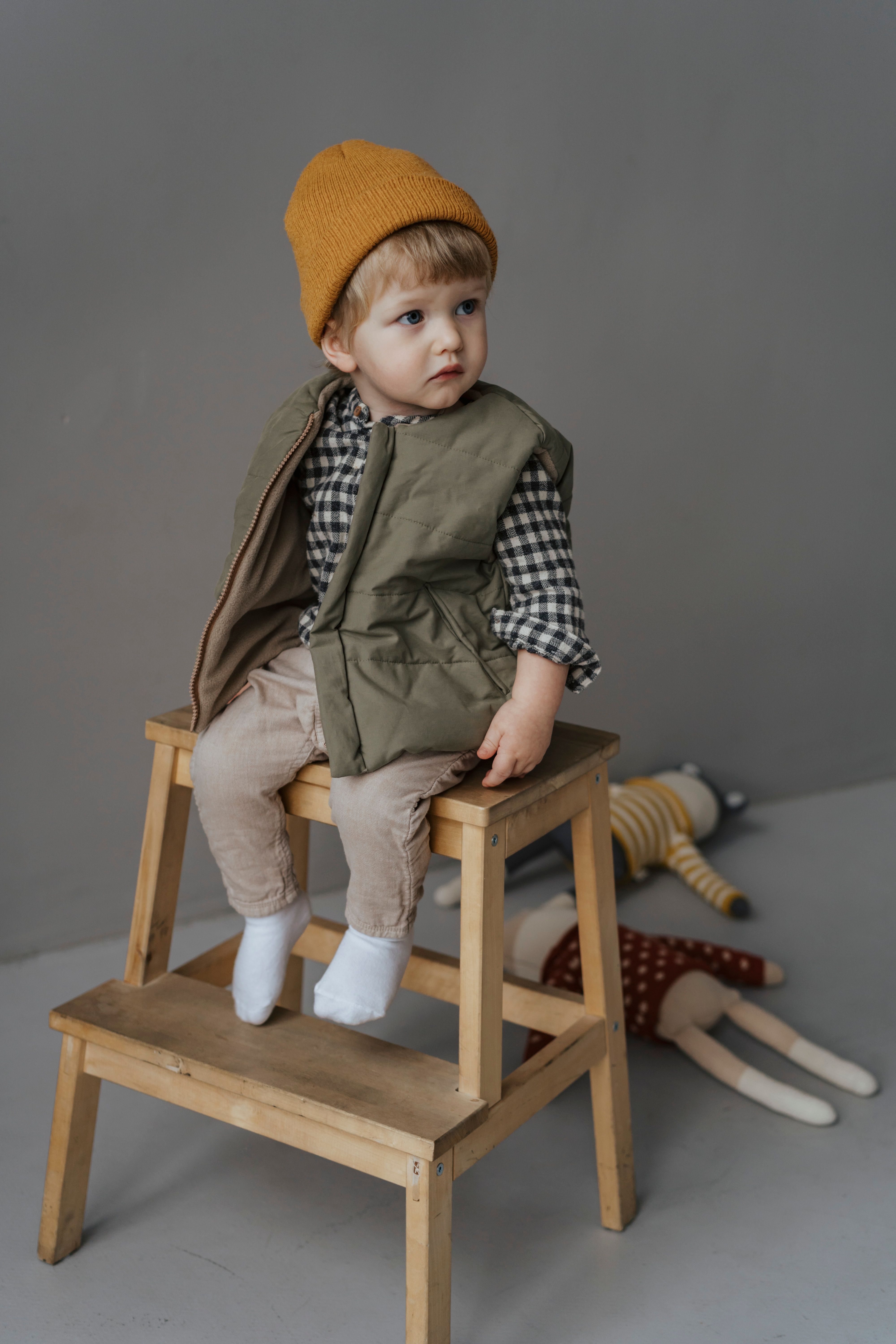 children's jacket on a wooden peg in soft daylight