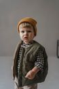 Boy in Black and Gray Plaid Dress Shirt and Brown Knit Cap