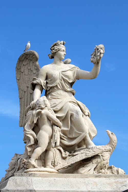 White Concrete Statue under Blue Sky