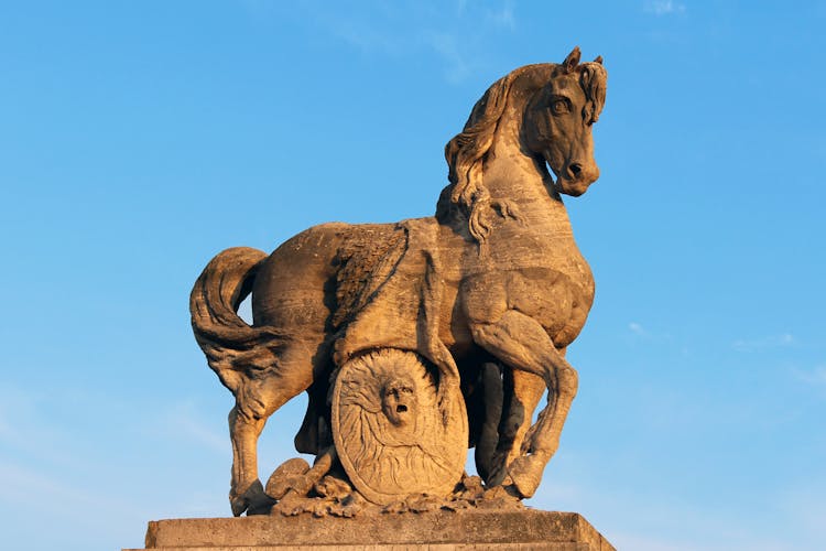 Brown Horse Statue Under Blue Sky