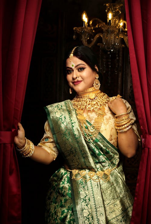 A Woman Wearing a Golden Dress and Jewelry