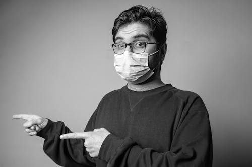 Free Man in Black Sweater Wearing Eyeglasses and Face Mask Stock Photo