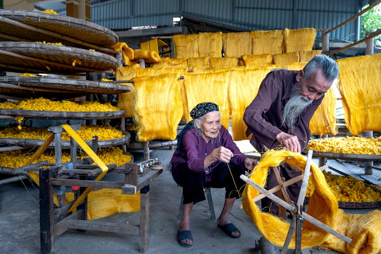 Elderly People Working With Fibers