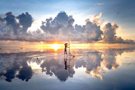 A lone fisherman casts his net at sunrise, reflecting on serene water.