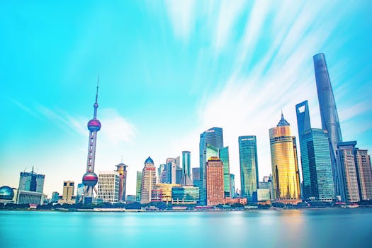 Stunning view of Shanghai's skyline with iconic skyscrapers and vibrant sky.