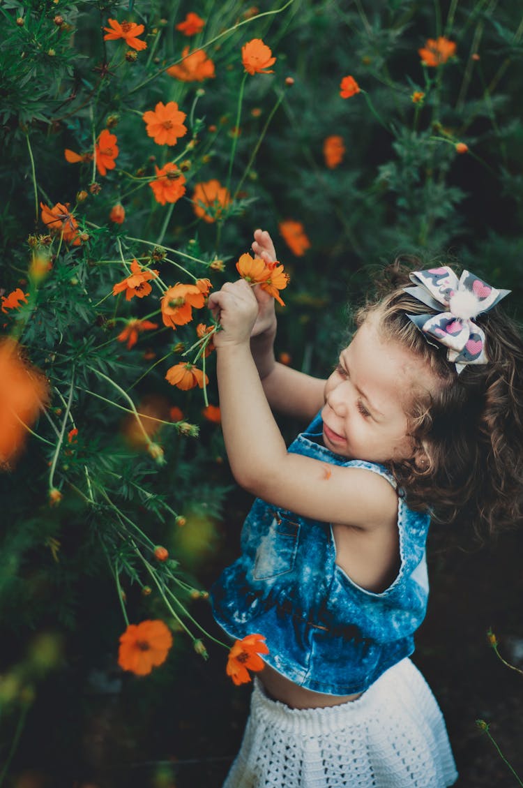 Naughty Girl Picking Blooming Flowers