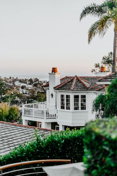 Elegant Laguna Beach home with stunning ocean views and lush greenery.
