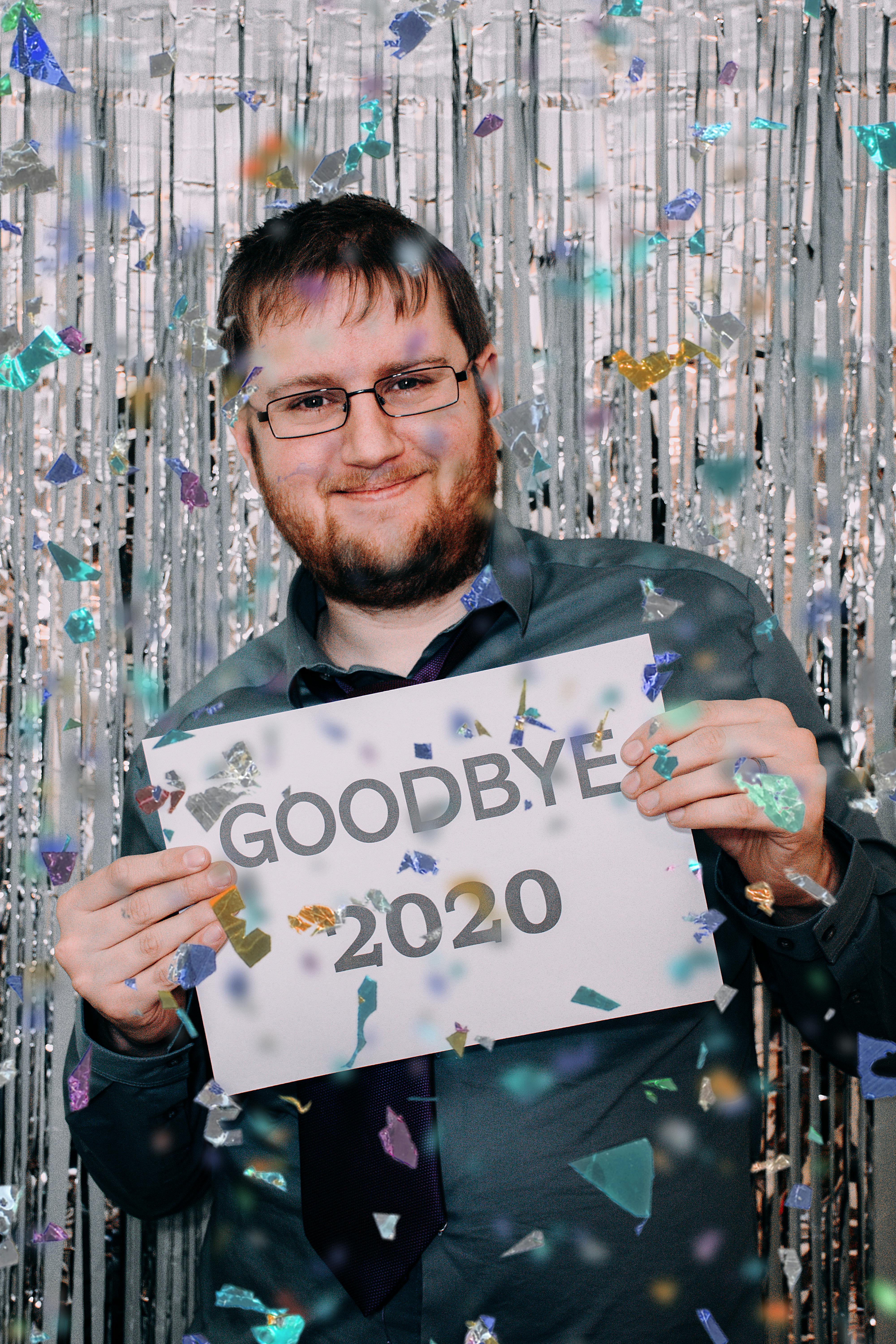 confetti falling on a man holding a paper