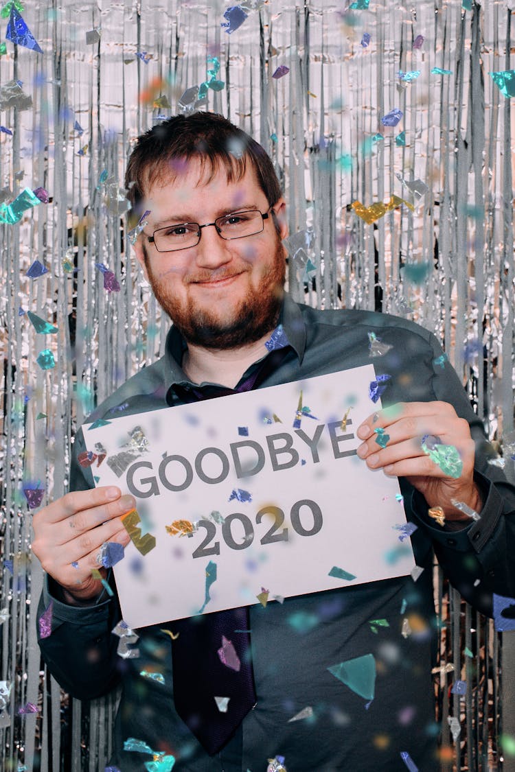 Confetti Falling On A Man Holding A Paper 