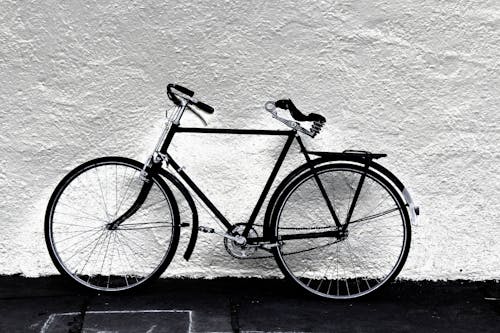 Free Black Bicycle near White Wall Stock Photo
