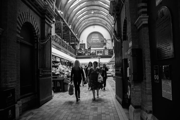 People Shopping On Indoor Grocery Market