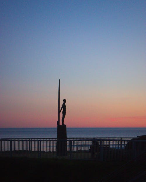 Sculpture Silhouette on Sea Landscape